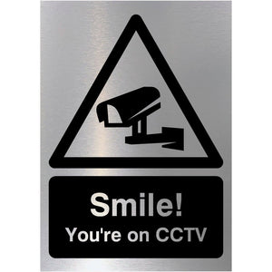 Smile You're On CCTV Sign in Brushed Silver